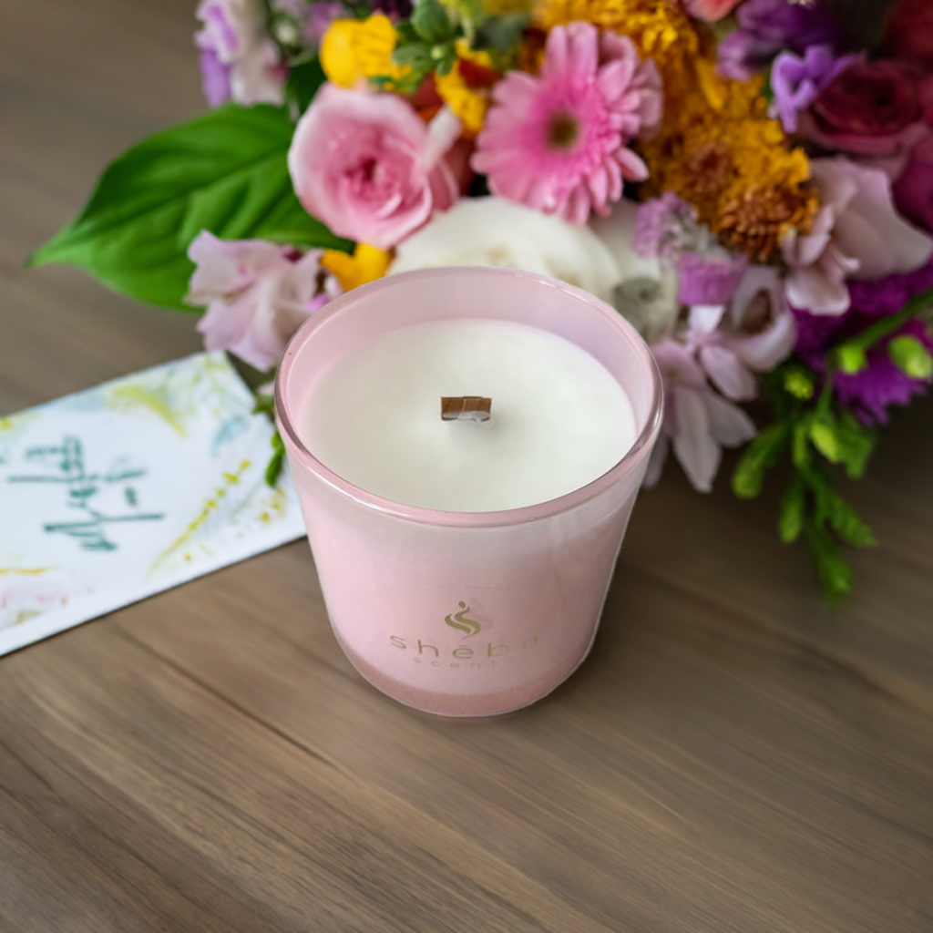 Gratitude candle in elegant pink shimmer glass jar with scent blend of French lavender, coconut cream, and lack orchid