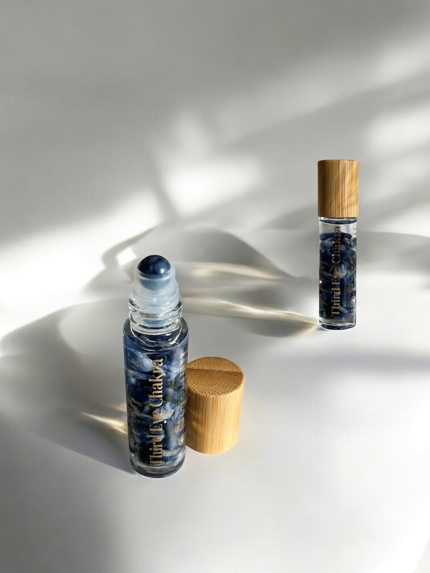 10 ml bottle infused with lapis lazuli crystals and ylang ylang, lotus, lavender, clary sage, pine and frankincense essential oils to support and balance the Third Eye Chakra by Sheba Scents