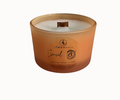 Orange glass jar made with coconut soy wax and ylang ylang, mandarin and cardamon oils to balance the sacral chakra