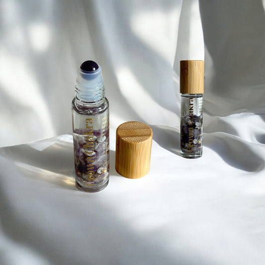 10ml clear bottle filled with amethyst crystals and amethyst roller ball for Crown Chakra balance and spiritual alignment