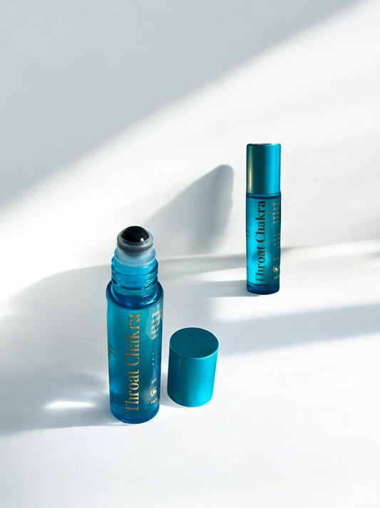 Throat Chakra Essential Oil Roll-On with turquoise glass bottle and sodalite roller ball